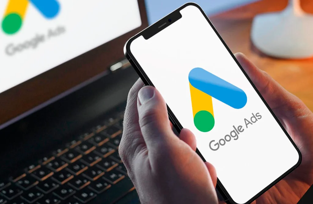 Google Ads campaign dashboard on a laptop and phone